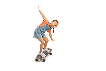 Happy Asian little girl child play surf skate board, isolate on white background.