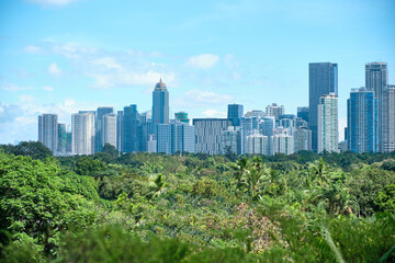 Manila, Philippines - Feb 02, 2020. View of the city of Manila from the pool of the luxury five-star Discovery Primea hotel. Sunny weather. Skyscrapers on the background.