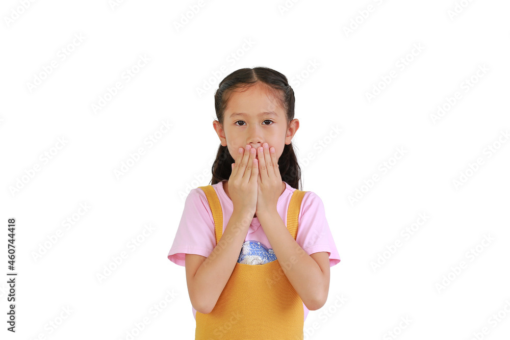 Wall mural pretty asian little girl kid covering her mouth with a hands isolated over white background