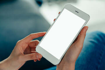 Woman hand holding smartphone and the screen is blank, social network concept, copy space for your advertising..