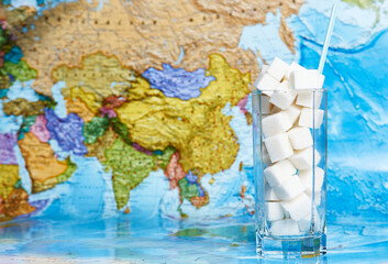 World Diabetes day concept. Glass of sugar cubes