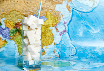 World Diabetes day concept. Glass of sugar cubes