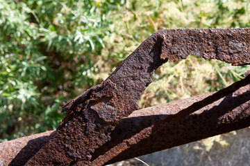 Fragment of rusted metal structures. Oxidation and destruction of steel outdoor. Corrosion