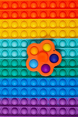 Popular toy Simple dimple on silicone surface POP IT. Selective focus, copy space