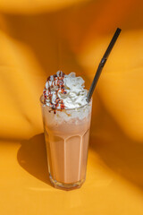 Coffee with Ice cream, milk and chocolate on abstract background.