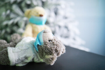 Teddy bears wearing protective mask. Coronavirus protection. Toy bear in mask to prevent virus spread. Copy space.