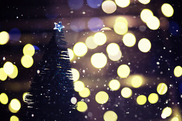 Fototapeta na wymiar Winter holiday background with frozen fir, glitter lights, bokeh. Christmas and New Year holiday background with copy space.