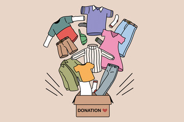 Charity and donating clothes concept. Box with donation word and carious human clothes flying from it for needing people vector illustration 