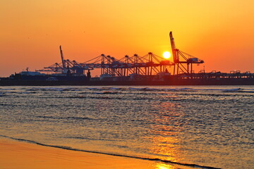 Fototapeta na wymiar Sunset at Taipei Port, industrial landscape with lift crane in Taipei Taiwan.