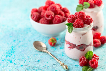 Delicious berry yogurt with fresh raspberries.