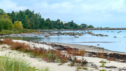 The unusual landscape of Kaltene beach, formed by large boulders covering the coast, morning hour, Kaltene rocky seashore, Latvia