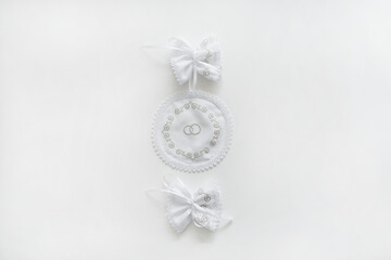 White embroidered wedding towels on a white background.