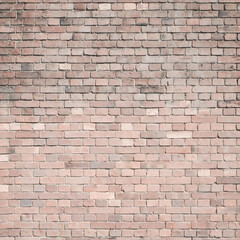 Old antique brick wall background. Aged retro brick texture backdrop.