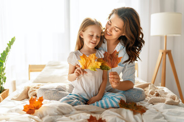 girl and mother enjoying sunny morning