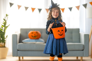 child with carving pumpkin