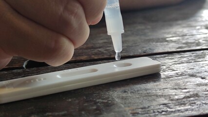 Using rapid test for COVID-19, quick fast antibody point of care testing.