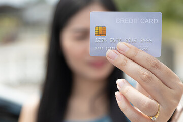 Closeup hand takes of credit card for financial transactions