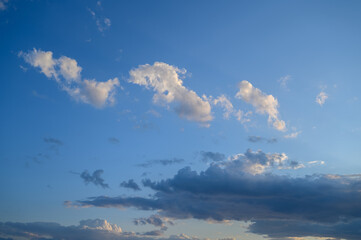 Naklejka na ściany i meble Beautiful white clouds against the blue sky.