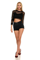 Young blond woman in short jeans and ner blouse