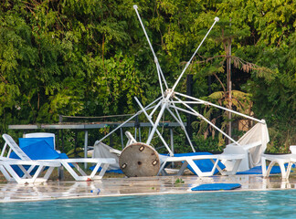 Straw loungers and sun loungers at the water park after  tornado.