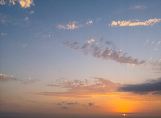 Colorful sunset in the sky with clouds.