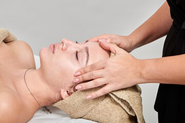 Fototapeta na wymiar Professional masseuse massaging her female client