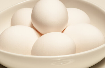 White eggs in a white bowl