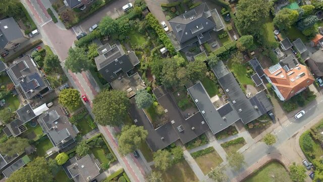 Top down aerial of a peaceful and wealthy suburban neighborhood