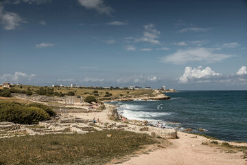 Fototapeta na wymiar Ruins of an ancient city on the seashore. Landscape photography. Journey. Beautiful sky.
