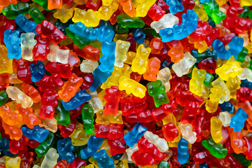 Fototapeta na wymiar many bright colored candies, background