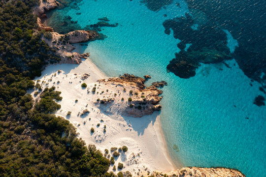 View from above, stunning aerial view of Spargi Island with Cala Soraya, a white sand beach bathed by a turquoise water. La Maddalena archipelago National Park, Sardinia, Italy.