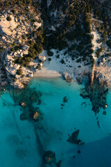 View from above, stunning aerial view of Spargi Island with Cala Corsara, a white sand beach bathed by a turquoise water. La Maddalena archipelago National Park, Sardinia, Italy.