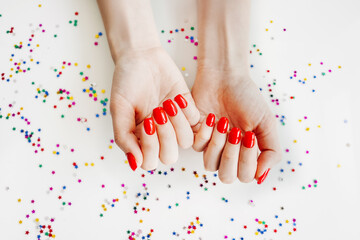 Obraz na płótnie Canvas Manicured woman's nails with red nail polish.