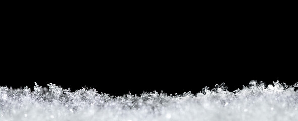 Natural snow texture with snowflakes close-up, isolated on black background with space for text on top. Template for holiday gift cards. Macro texture of snow. Big large size. - 460771265
