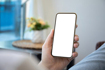 male hands holding phone with isolated screen in room house