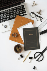 Aesthetic home office desk workspace with laptop computer, notebook, tabled pad on white background. Flat lay, top view blog, website, social media concept.