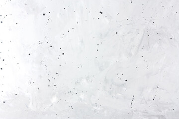 Gray concrete background with black dots. Copy space.