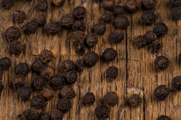 black pepper on wooden table