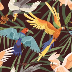 Seamless tropical pattern with parrots in jungles. Endless background with exotic birds and palm leaves. Repeatable Hawaiian print with aras and macaws. Colored flat vector illustration for fabric © Good Studio