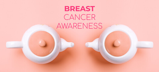 Banner. Two white porcelain teapots with a pink lid on a pink background. Flat lay. Concept of...