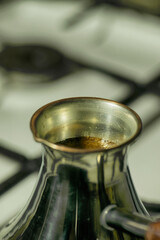 Making coffee. A vessel for brewing coffee. Close-up of the picture. Ground coffee.