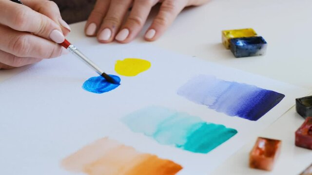 Artistic person practicing hardly in the watercolor art