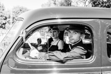 Young couple in retro car