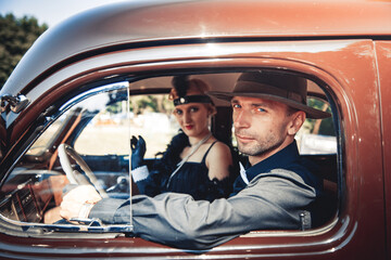 Young couple in retro car