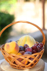 Vintage basket filled with various fruit. Selective focus.