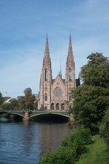 Fototapeta na wymiar Strasbourg - France - 2 October 2021 - view of panorama of il river with saint paul Cathedral
