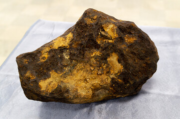 large yellow brown iron meteorite © Semiglass