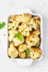 Beer battered spicy cauliflower nuggets in baking dish. Space for text, top view.