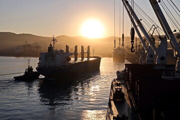 Various sunrise views of the piers, terminal and coastline of the Port of Vostochnyy. Russia, December,2020