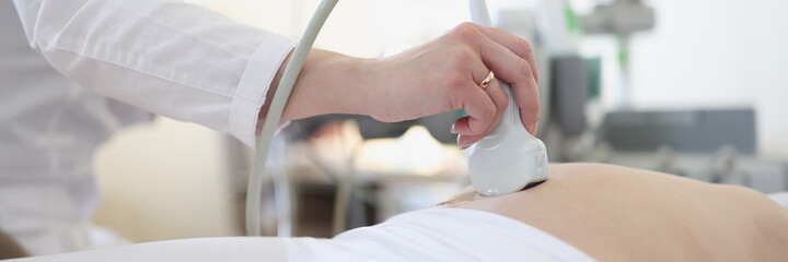 Ultrasound scanner device in hand of professional doctor examining his patient